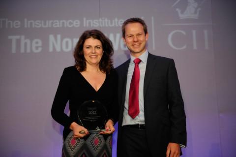 Morven Millar is presented with the Chartered Financial Planner of the North West Award by Kevin Roberts from RSA