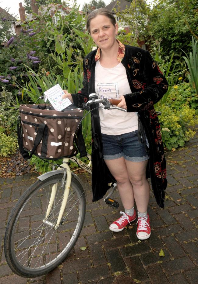 Carol Ferro with her cycling diary.