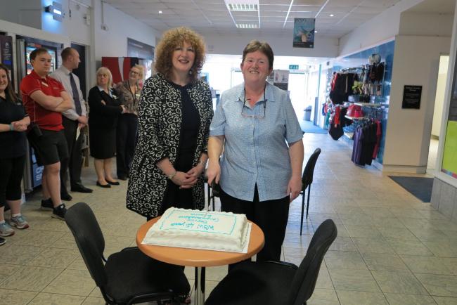Diane Swindell is congratualted on her 42 years' service by Trafford Council chief executive Theresa Grant